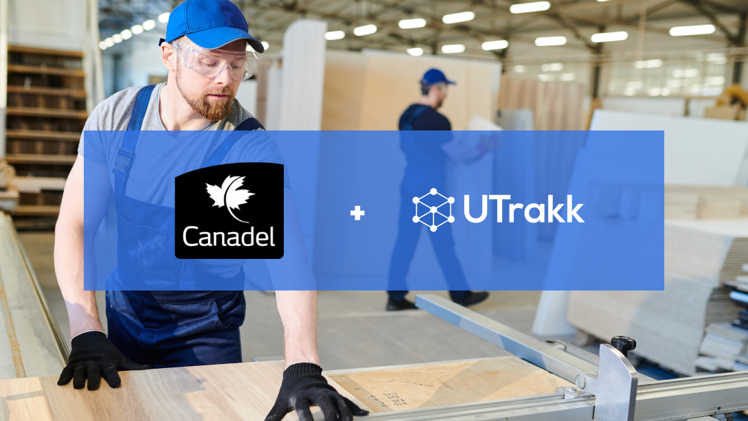 Worker wearing blue overalls and cap, cutting a board in a workshop