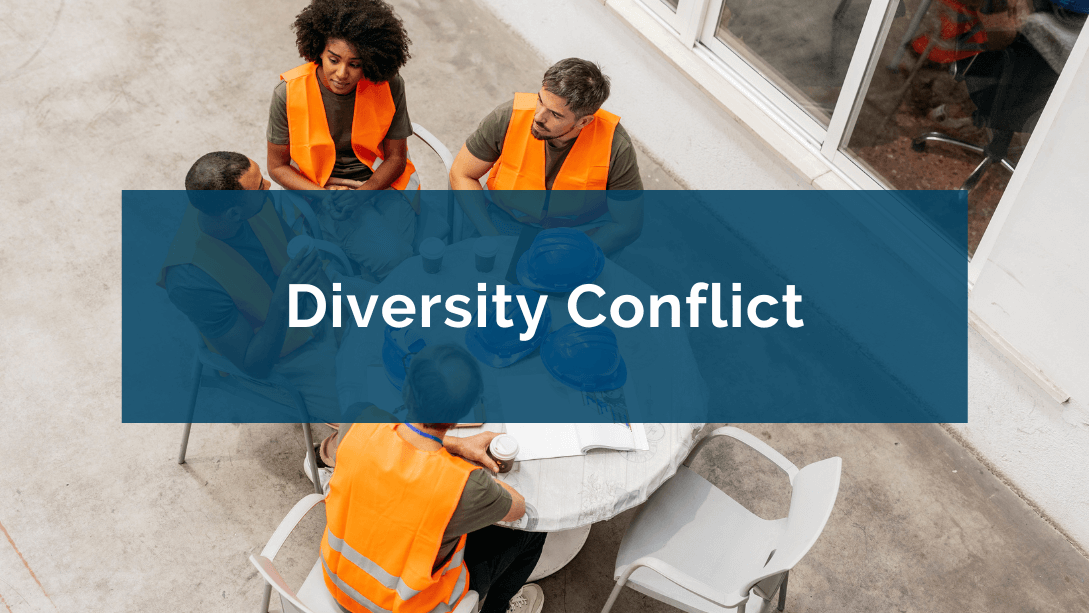 Bird's-eye view of a diverse team discussing while seated at a round table