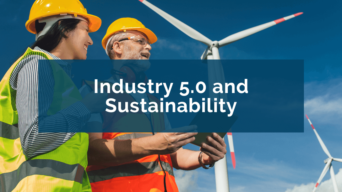 Two workers wearing safety vests and helmets, looking into the distance, smiling, in a wind farm